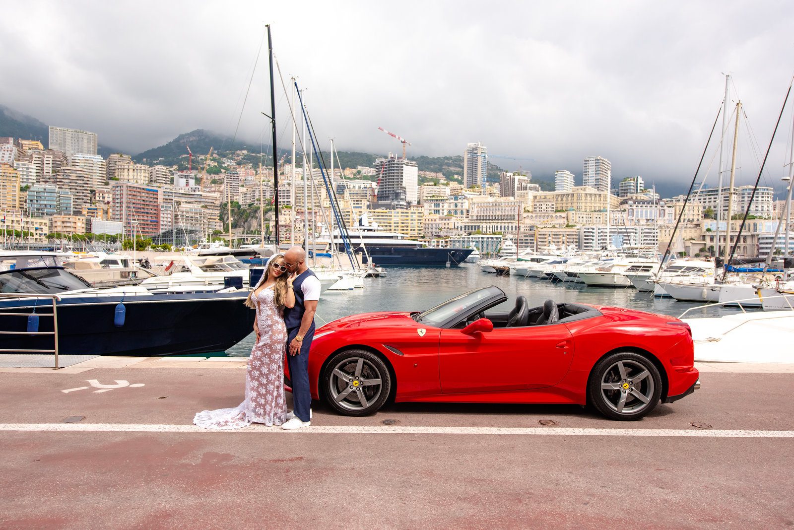 Luxury concierge photography with red Ferrari in Monaco harbor